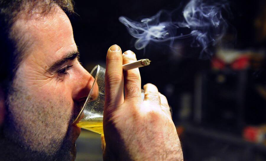 men smoking and drinking